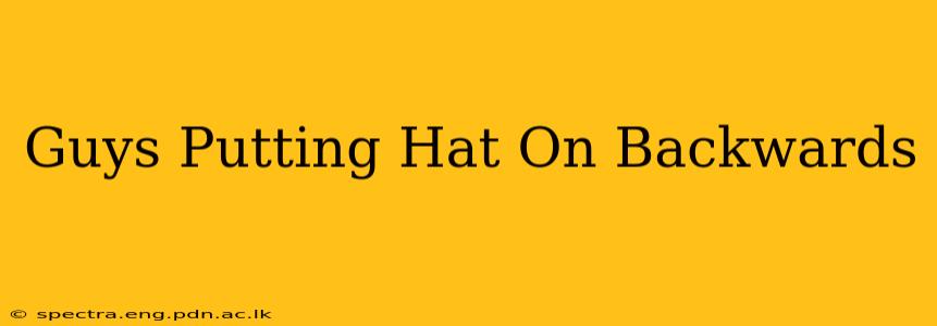 Guys Putting Hat On Backwards